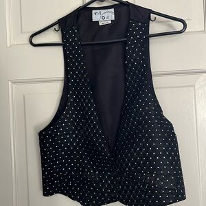 Try One black vest with gold & silver dots.